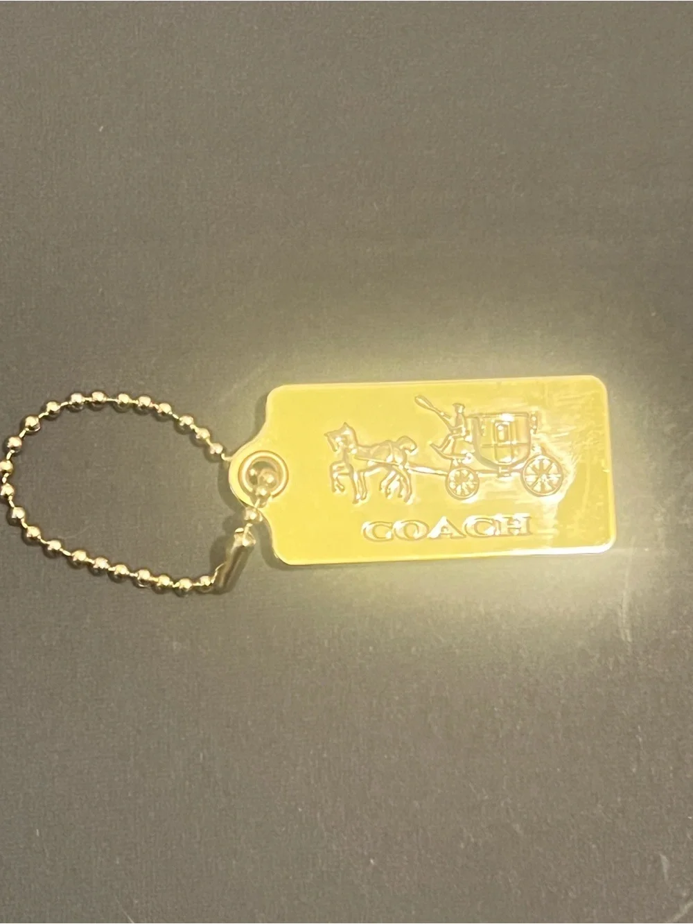 Rare Vintage Coach Gold Tone Embossed Horse & Carriage Dog-Tag Key Holder